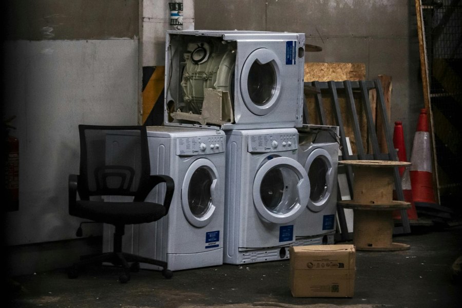 Old washers and appliances ready for removal